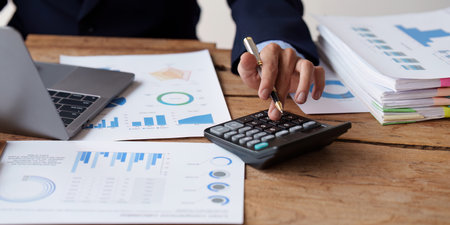 Close up Accountant man working with calculator and do document, tax, exchange, accounting and...