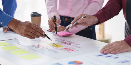 Group of Diverse Creative discussion about analyzing data financial report and new start up project, discussion the charts and graphs, Business finances and accounting conceptの写真素材