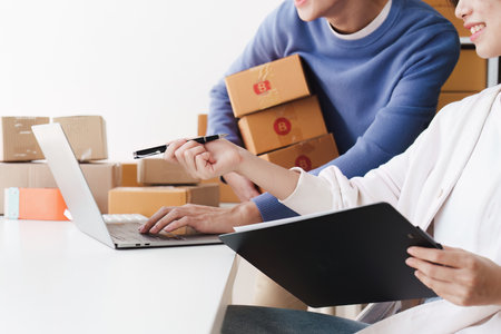 Small business owners couple entrepreneurs working with parcel, e-business, marketing, online shop, sme, entrepreneursの写真素材
