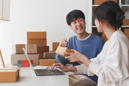 Small business owners couple entrepreneurs working with parcel, e-business, marketing, online shop,...