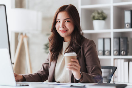 Accountant woman working on laptop and do document, tax, exchange, research, accounting and Financial advisor conceptの写真素材