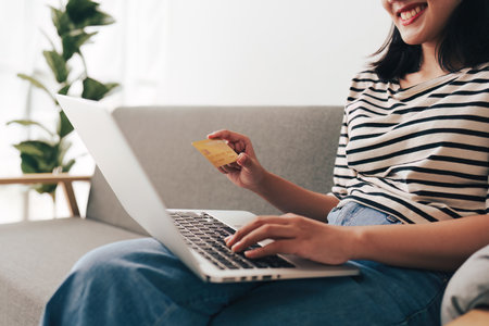 Young asian woman worried about credit card debt, stress, problem, finance, bankruptcyの写真素材