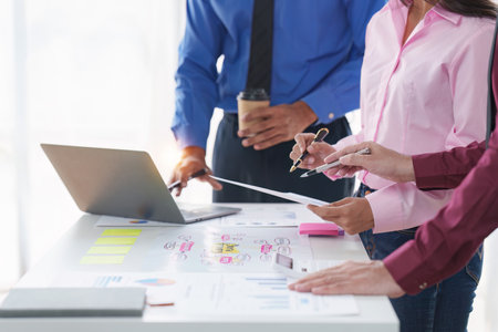 Group of Diverse Creative discussion about analyzing data financial report and new start up project, discussion the charts and graphs, Business finances and accounting conceptの写真素材