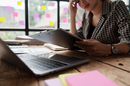 Stressed and Burnout. Business woman worry about her work at officeの写真素材