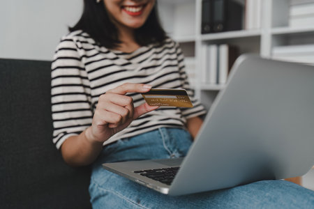 Young asian woman worried about credit card debt, stress, problem, finance, bankruptcyの写真素材