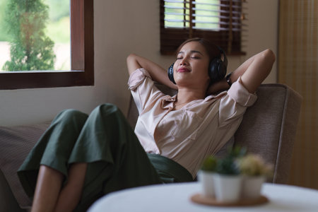 Attractive Asian woman resting comfortable living room, Relax, Sofa, Lifestyleの写真素材