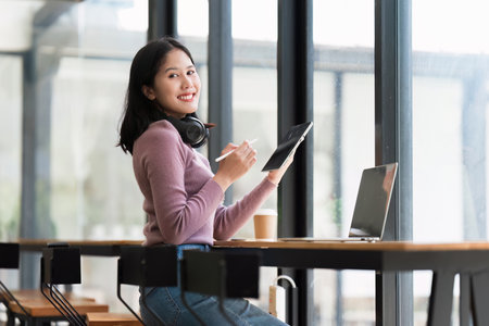 Young student studying in classroom at college. Student working at background. education, back to school conceptの写真素材
