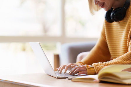 Attractive Asian woman resting comfortable living room and using laptop computer, Relax, Sofa, Lifestyleの写真素材