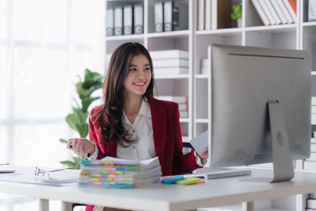 Accountant asian woman working on laptop and do document, tax, exchange, accounting and Financial advisor conceptの写真素材