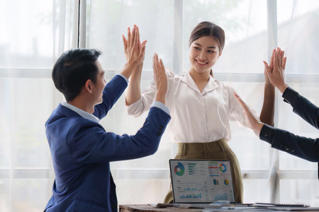 Group of Business People Meeting and Corporate partnership and achievement concept. Business people celebrate when successful work projectの写真素材