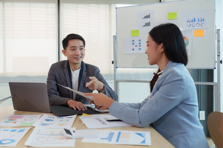 Business People Meeting to analysis the financial report paperwork in office. Financial advisor teamwork and accounting conceptの写真素材