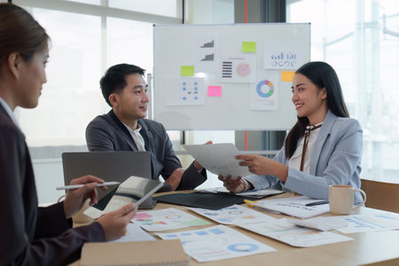Business People Meeting to analysis the financial report paperwork in office. Financial advisor teamwork and accounting conceptの写真素材