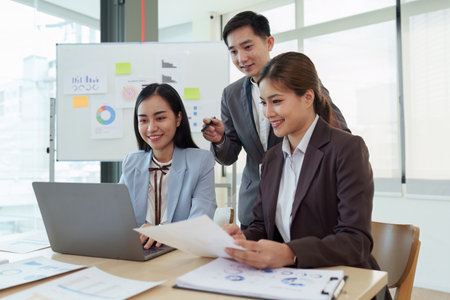 Business People Meeting to analysis the financial report paperwork in office. Financial advisor teamwork and accounting conceptの写真素材