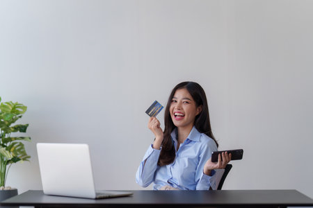 Woman enjoy with shopping. Elevate Your Ecommerce with Captivating Photography: Online Shopping and Payment Conceptの写真素材