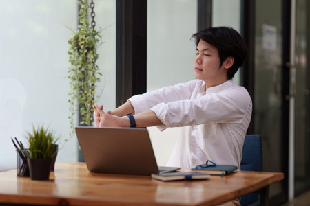 Businessman in office relaxing in chair. Resting with thoughtful mind thinking of life quality