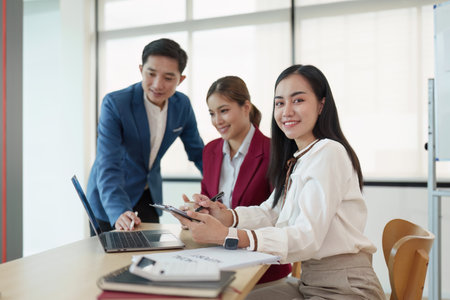 Diverse business team stacking hands and collaboration and analyze financial data for long term investmentsの写真素材