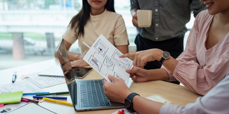 Young developer and ui designer brainstorming interface wireframe design.Creative digital development agencyの写真素材