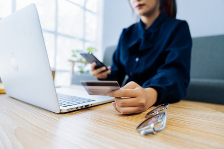Young woman use credit card for online shopping on internet website. Online shopping, e-commerce,...