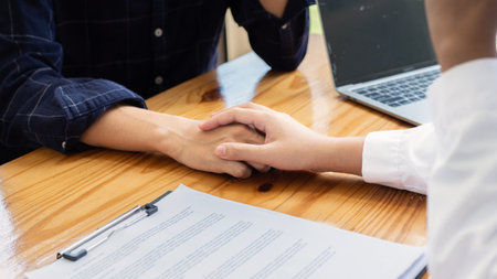 Doctor holding the patient hand to cheer upの写真素材