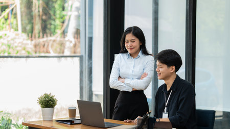 Male and female consult work and exchanges of opinions between chief executive officers.の写真素材