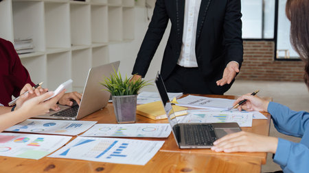 analyst team is doing teamwork and brainstorming about new strategy project at the meeting room.の写真素材