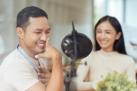 Podcaster is interviewing a guest about the content topic of LGBTQIA. Podcast conceptの写真素材