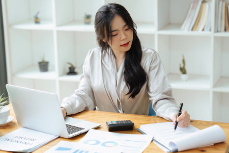 Professional Accountant Woman In Office Doing Accounting And Budgetの写真素材