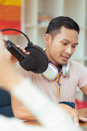Podcaster is interviewing a guest about the content topic of LGBTQIA. Podcast conceptの写真素材