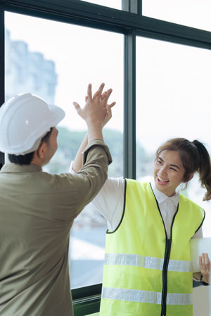 engineer teamwork and architect working and high five for successful job at construction site