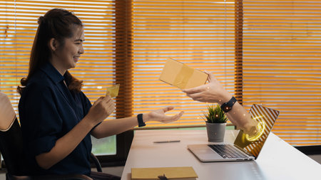 Young Asian women shopping online with credit cards with delivery serviceの写真素材