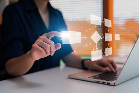 Businessman using a computer analysis for process and workflow automation with flowchartの写真素材