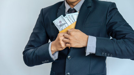 businessman or corrupt politician is offering bribes that are given in the form of dollar cash To do...