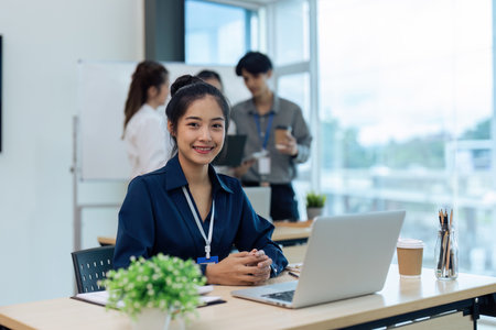 Accountant woman audit and laptop with financial paperwork at officeの写真素材