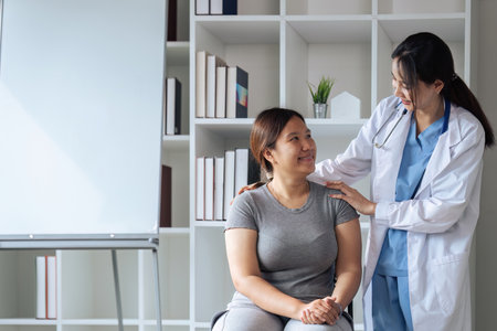 Smiling young female nurse touch comfort mature Caucasian patient in modern private hospitalの写真素材