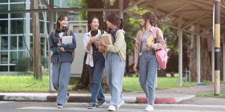 Group of Young Asian student walking and talking at university before class room. education, back to school conceptの写真素材