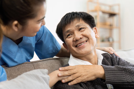 elderly touch hand on back of hand caregiver or nurses to express thankful