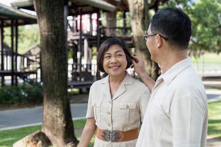 elderly married couple retired have a picnic together in the park. senior retired conceptualの写真素材