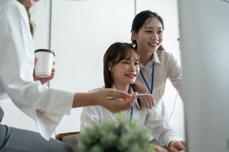 Group of people working together on a project in a startup company officeの写真素材