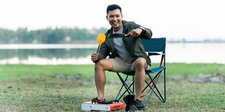 Asian man travel and camping alone at natural park in Thailand. Recreation and journey outdoor activity lifestyleの写真素材