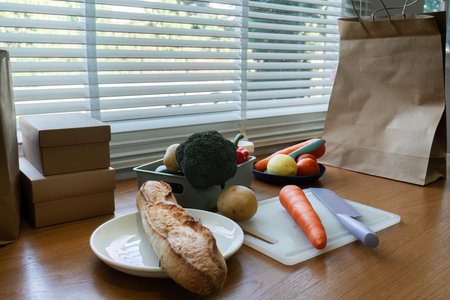 healthy and vegetarian foods background. Vegetables and bread on brown table. Prepare to cook...