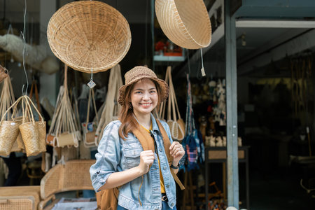 Young female tourist walking across the street in local market. travelling concept