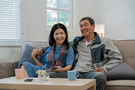 Relax, home and mature couple on sofa hug for bonding, healthy relationship and marriage. Retirement, happyの写真素材