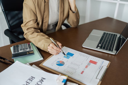 Business woman finance working with the performance from the companys rapidly growing graphの写真素材