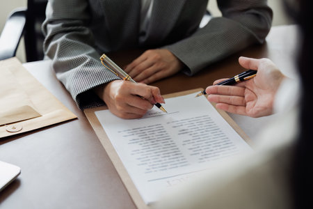 Hand of lawyer pointing at document agreement, contract for businessperson, client signing contract