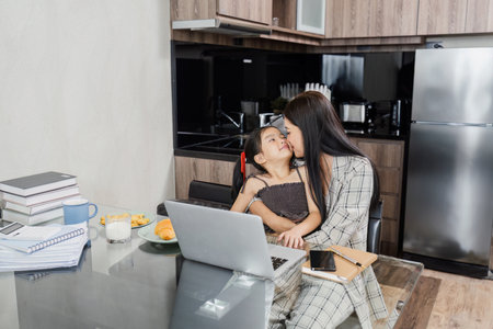 business woman work from home and take care of her child while workingの写真素材
