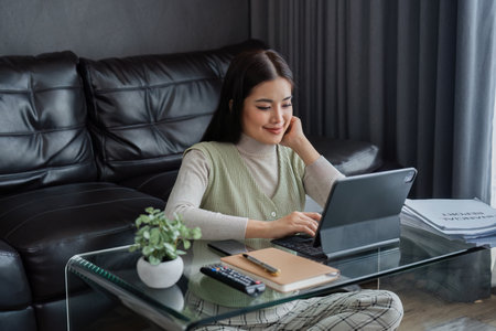 young asian business woman, freelance data accountant work from home, work remotely at homeの写真素材