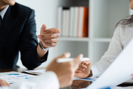 business man talking and discuss with team about strategy finance analysis at meeting roomの写真素材