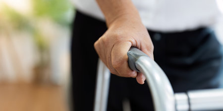 A person is holding a walker with a hand on the handle. healthcare conceptの写真素材
