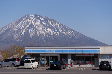 Hokkaido - Sapporo, Japan - May 01 20204 - Lawson with Mountain in the backgroundのeditorial素材