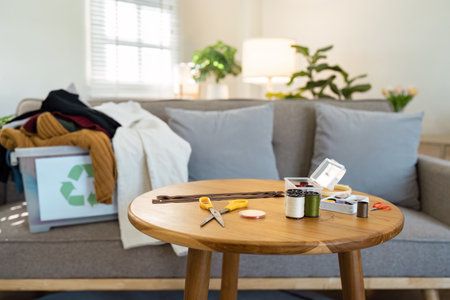 Cozy Living Room with Sewing Supplies and Recycled Clothing on Sofa in Bright Natural Light